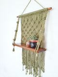 Macrame shelf with succulents and crystals