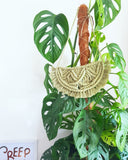 large green macrame necklace with monstera